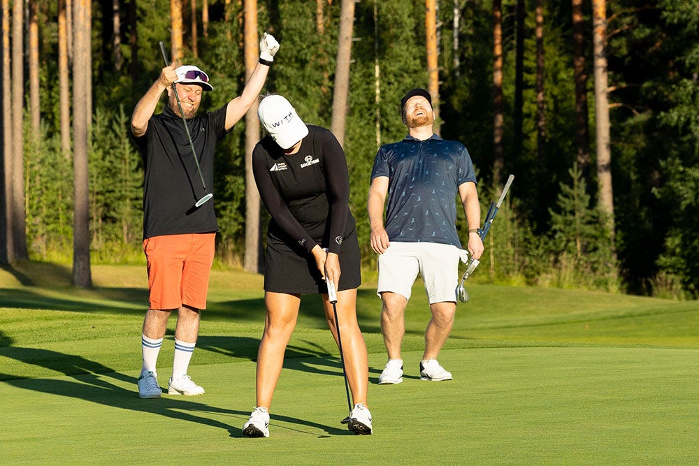 Matilda Castren and two others playing golf