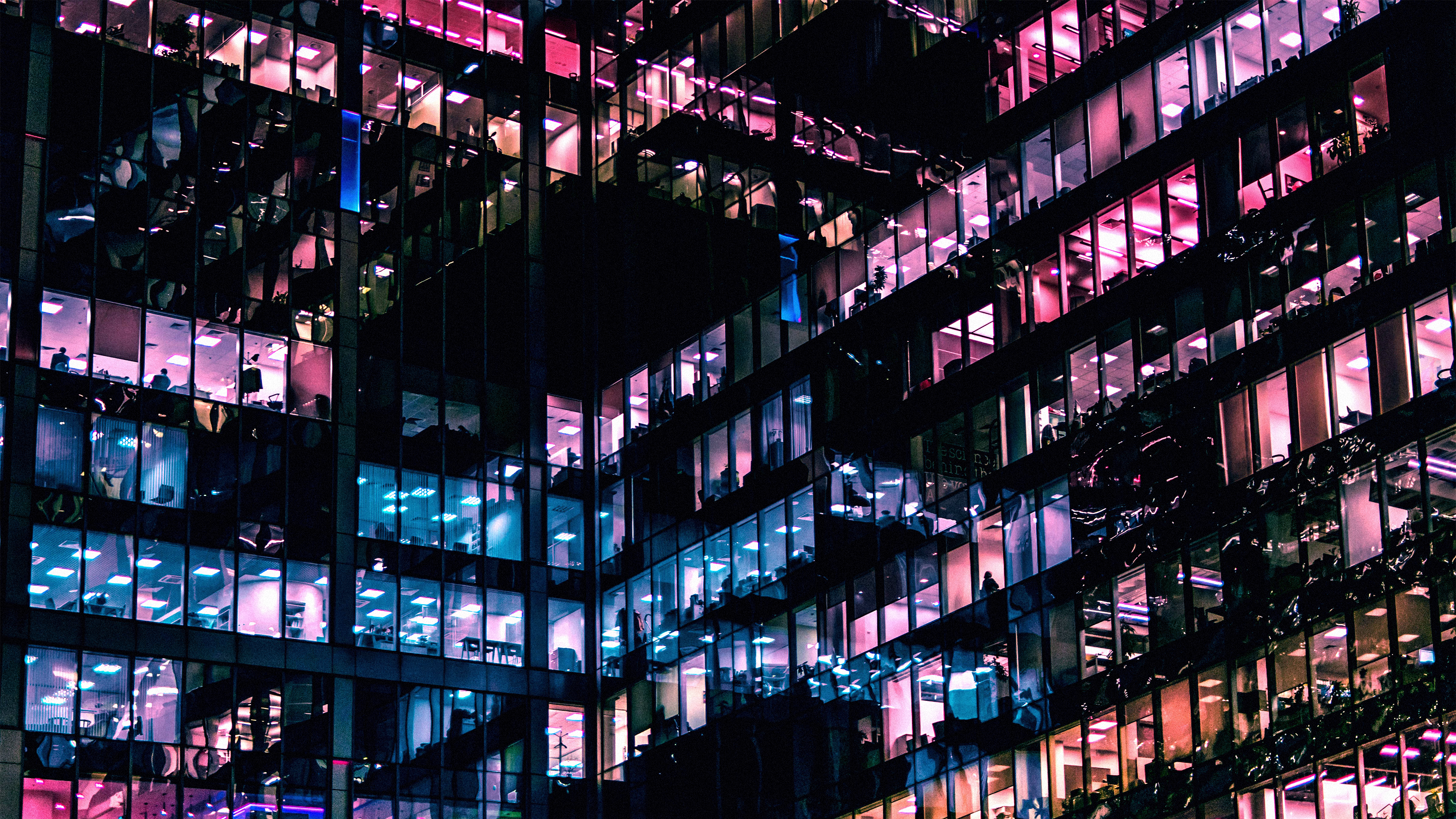 multicoloured lights office windows at night multicoloured lights office windows at night