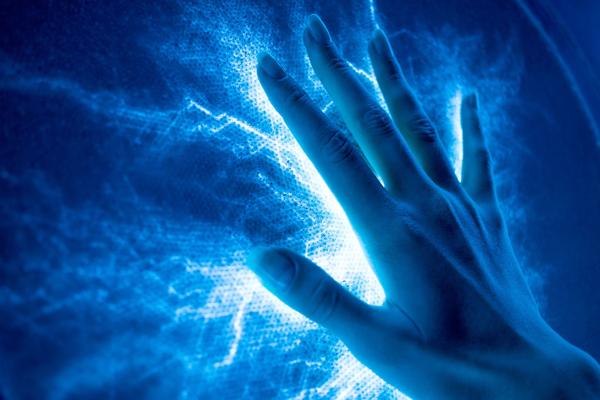 The touch of the hand to the luminous electric surface-emitting light similar to electric discharges WIthSecure Elements Quarterly