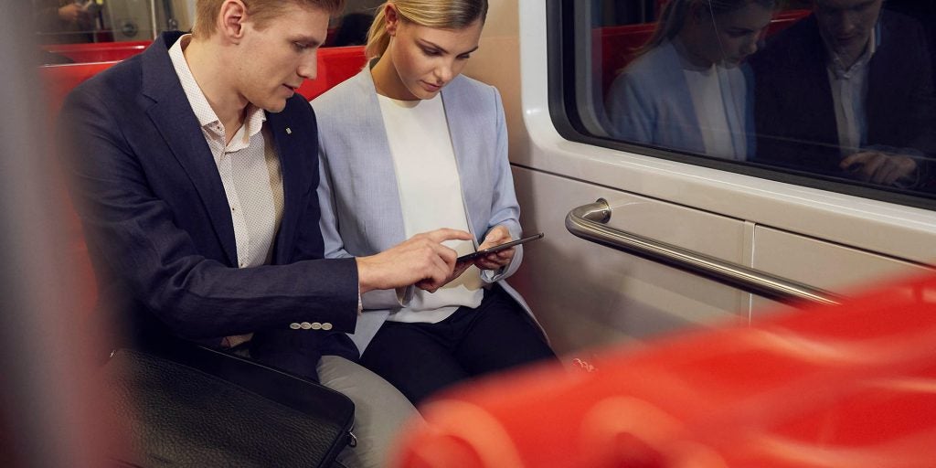 ws_business_metro_couple_looking_at_phone