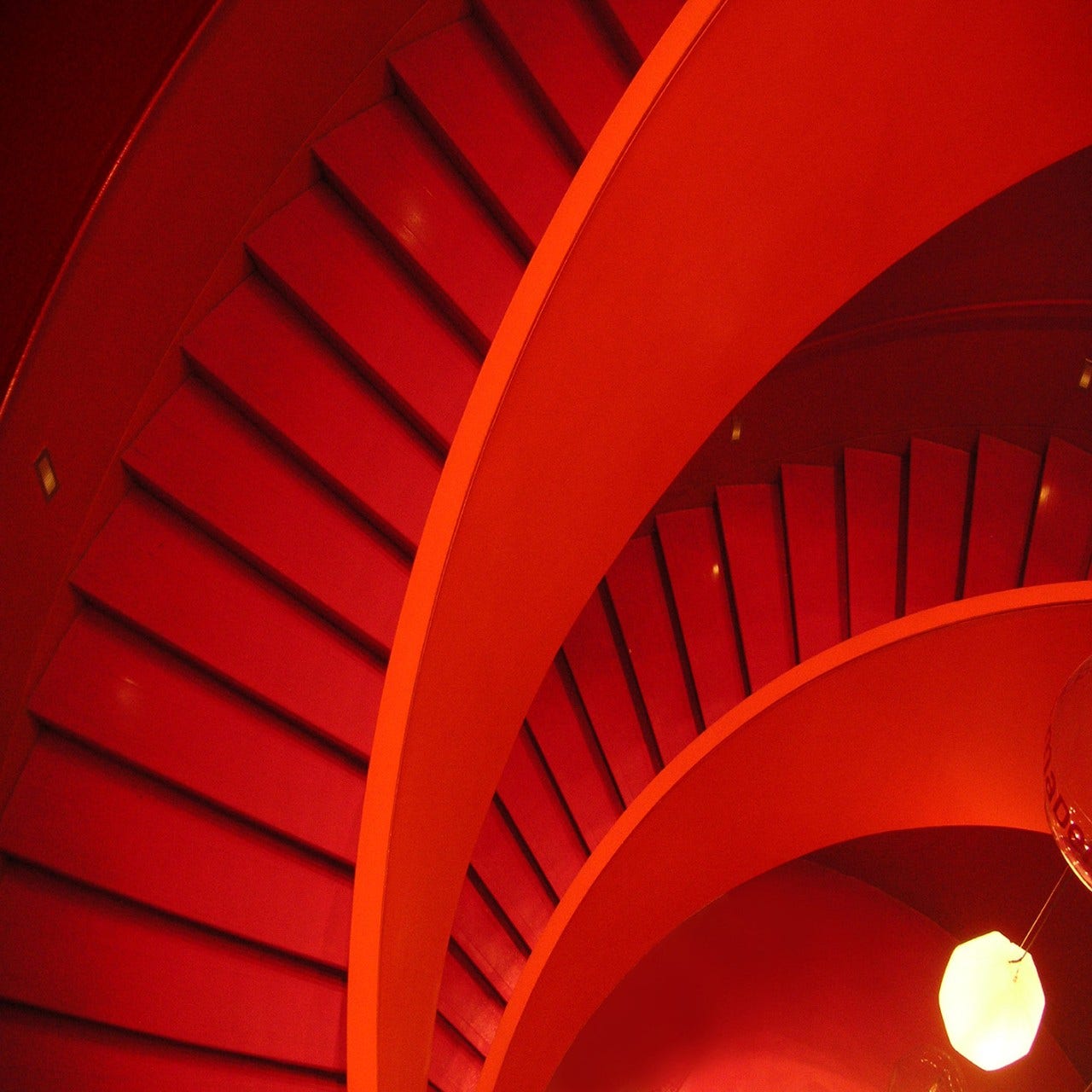 red spiral staircase abstract