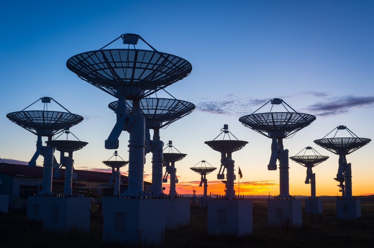 ws_silhouette_satellite_dishes_point_up_into_sunrise_sky