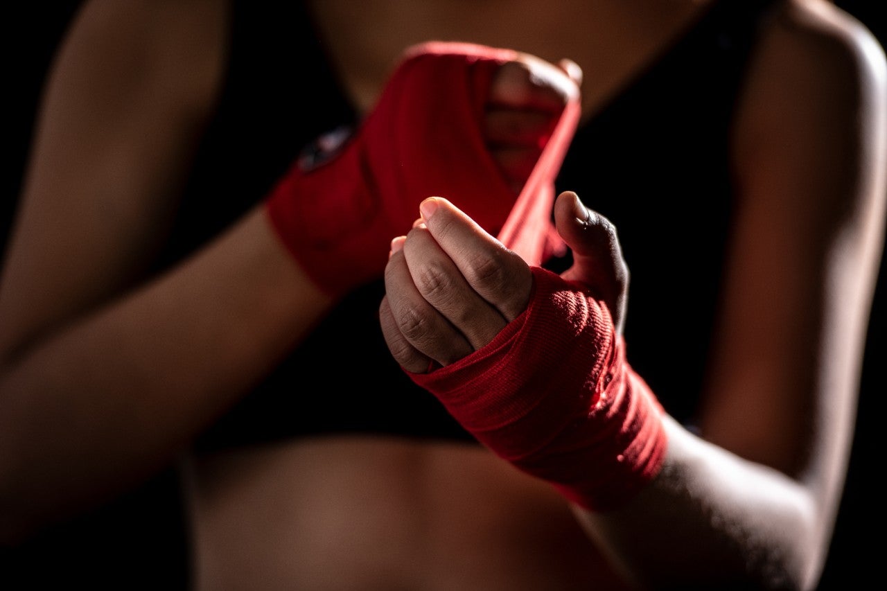 ws_woman_with_red_boxing_hand_wraps