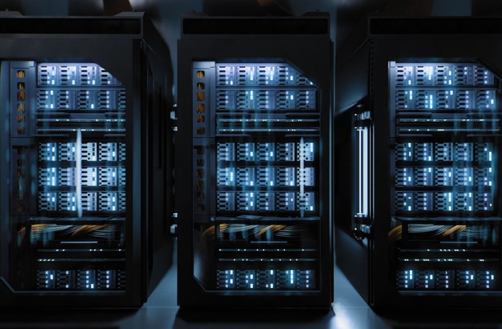 1316753802 A large hallway with supercomputers inside a server room data center. Technology used for cloud computing and network security.